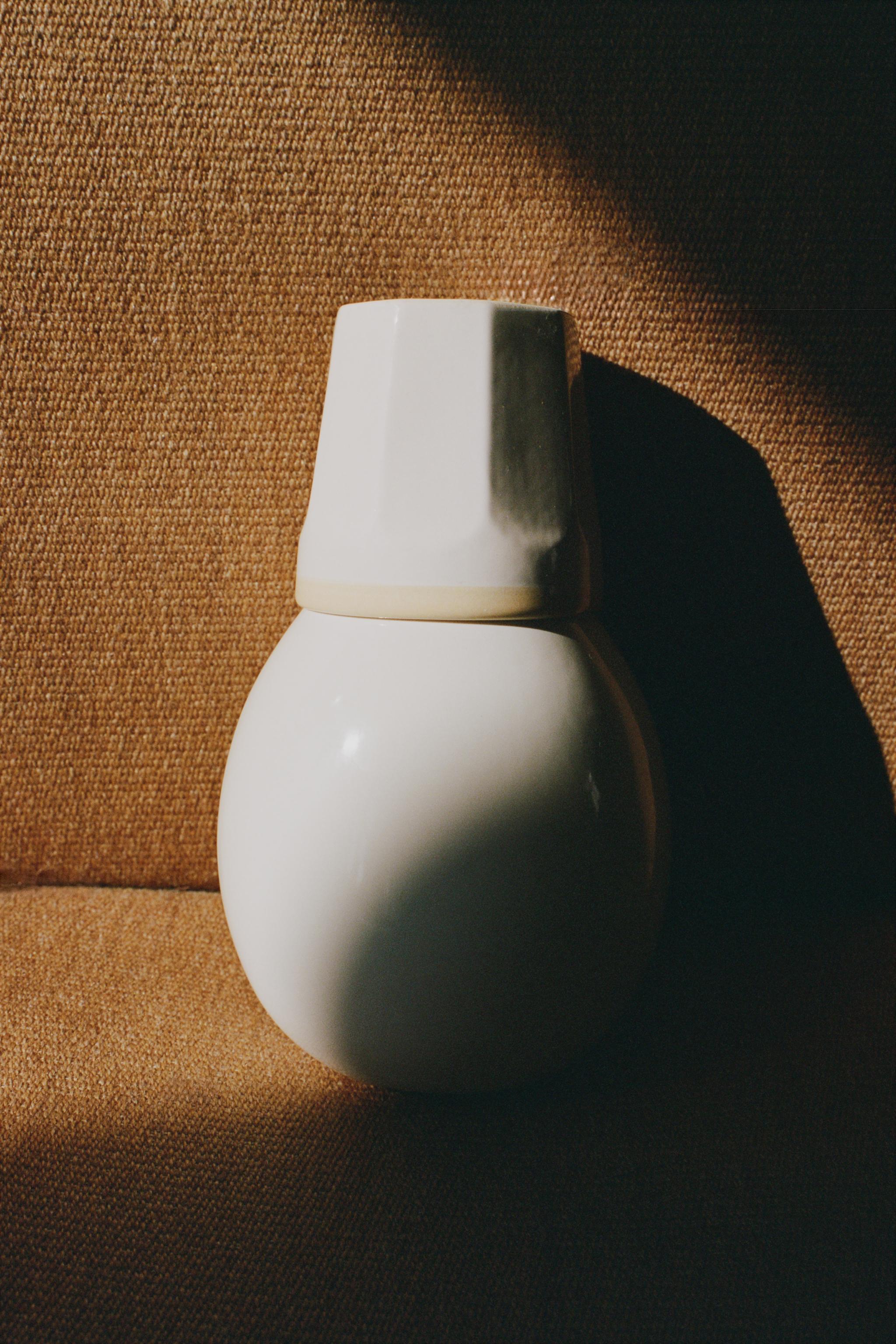CERAMIC BOTTLE AND TUMBLER BEDSIDE SET